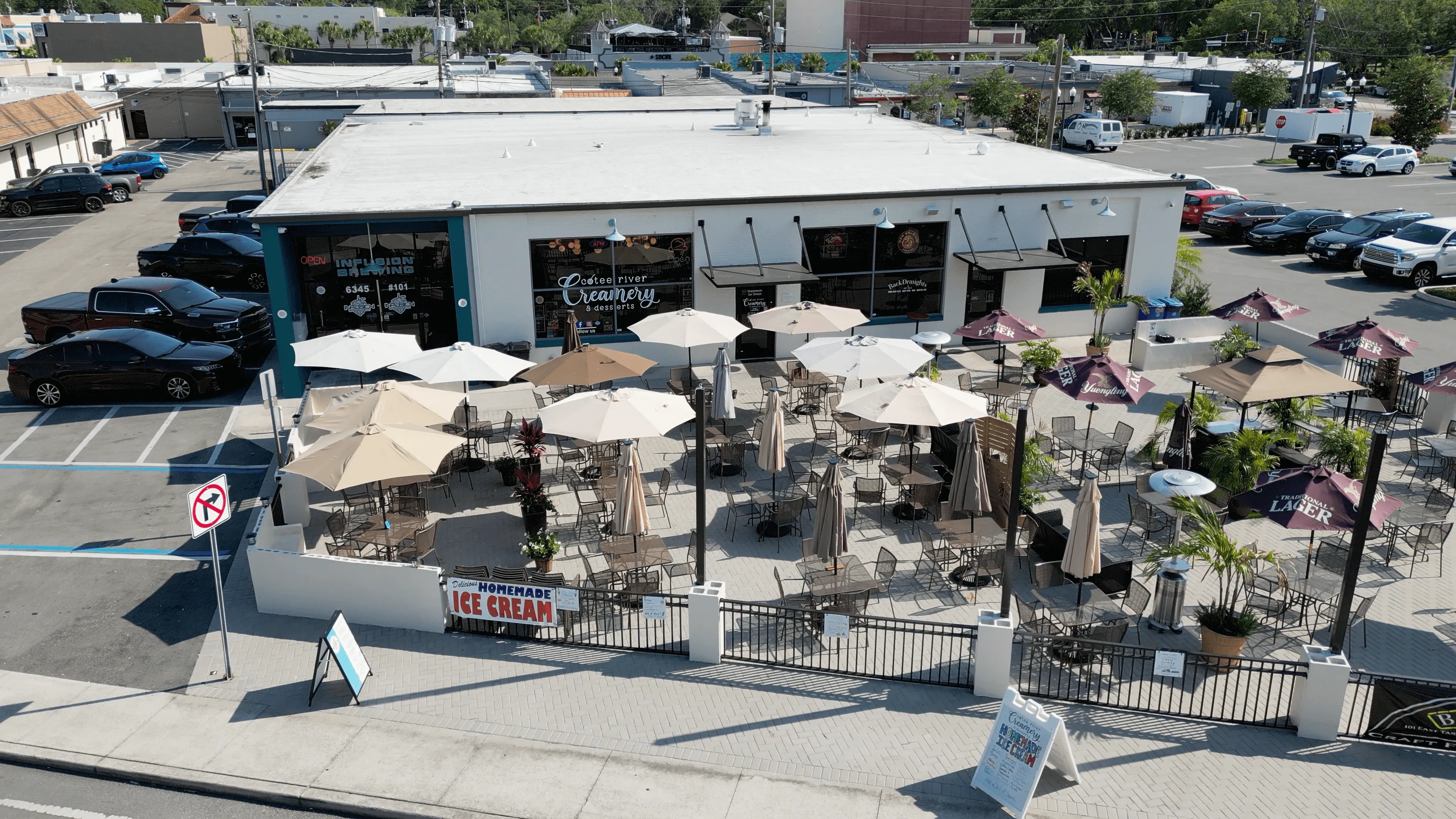 Aerial view of The Commons on Grand building and waterfront in downtown New Port Richey, Florida
